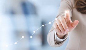 Business professional tracking apprentice progress and performance growth with rising graph and analytics dashboard