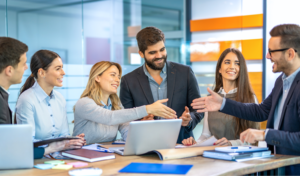 Business team welcoming and supporting a new apprentice in a collaborative office environment.