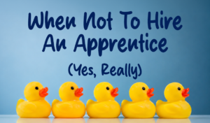 Five yellow rubber ducks in a row beneath the title “When Not To Hire An Apprentice (Yes, Really!)” representing strategic apprenticeship planning for employers.