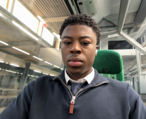 Jordan Njipap, Accountancy Learning Star Student for August 2026, pictured travelling on a train.